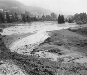 The mud poured downhill in a semi-fluid state.